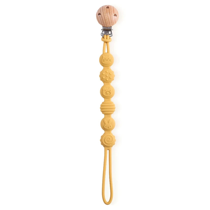 Yellow pacifier clip with wooden beads on a white background