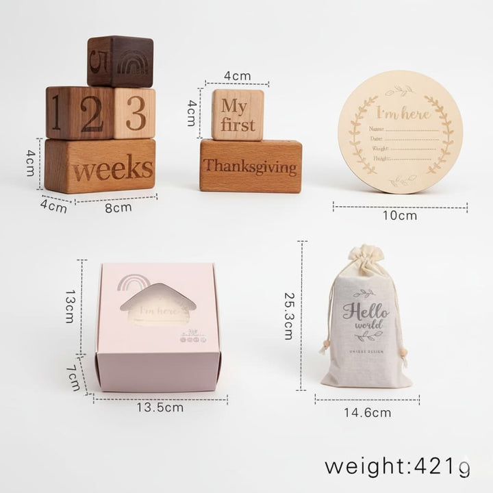 Set of wooden blocks, a baby shower gift bag, and a small box with dimensions and weight displayed.