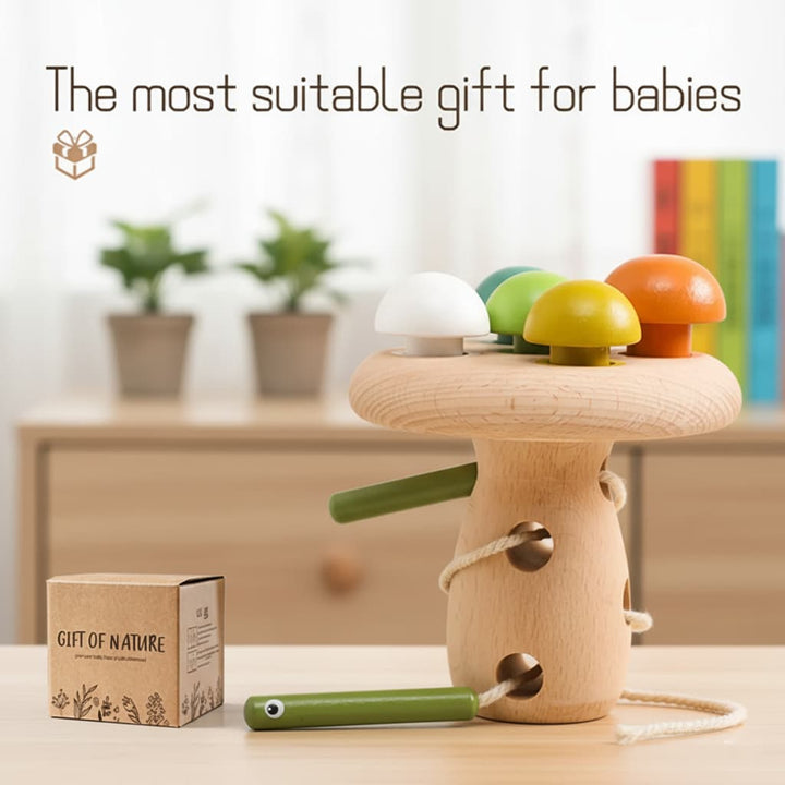 Wooden toy with colorful mushroom-shaped tops on a wooden stand, accompanied by a box labeled 'Gift of Nature'.