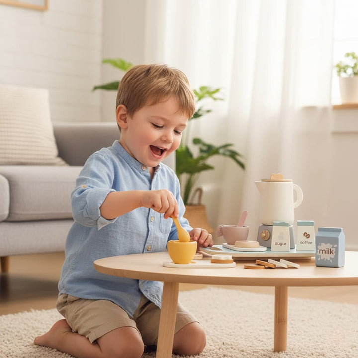 Child playing with a toy tea set on a small table in a bright living room.