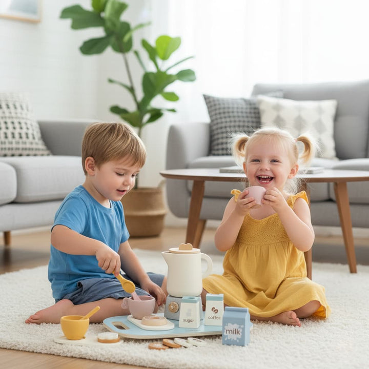 Two children playing with toy kitchen set on a rug in a living room.