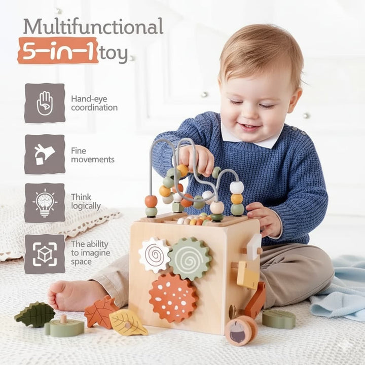 Child playing with a wooden toy set on a white surface