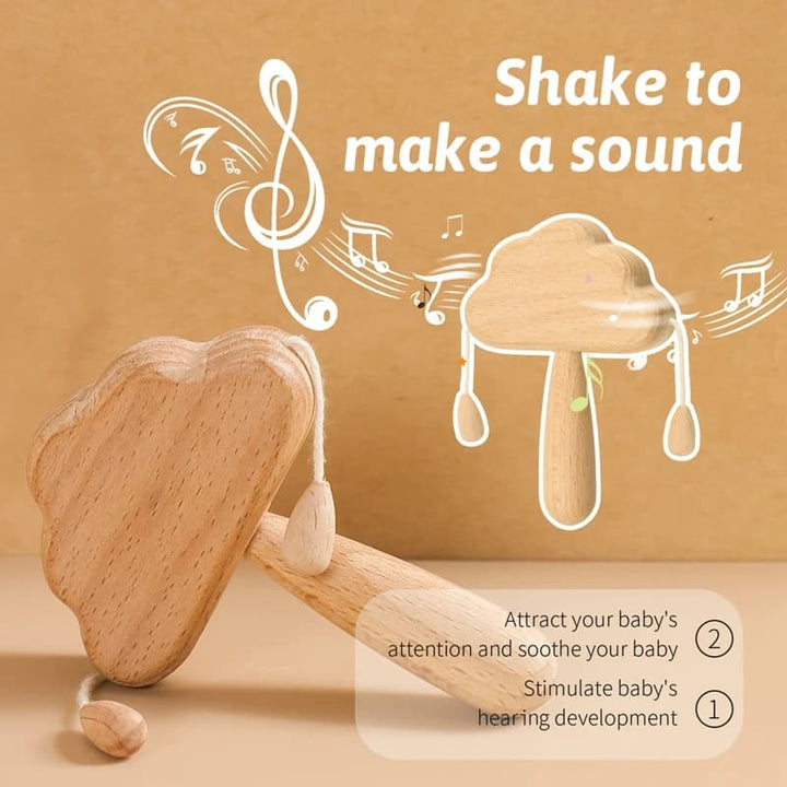 Wooden baby rattle with text on a beige background