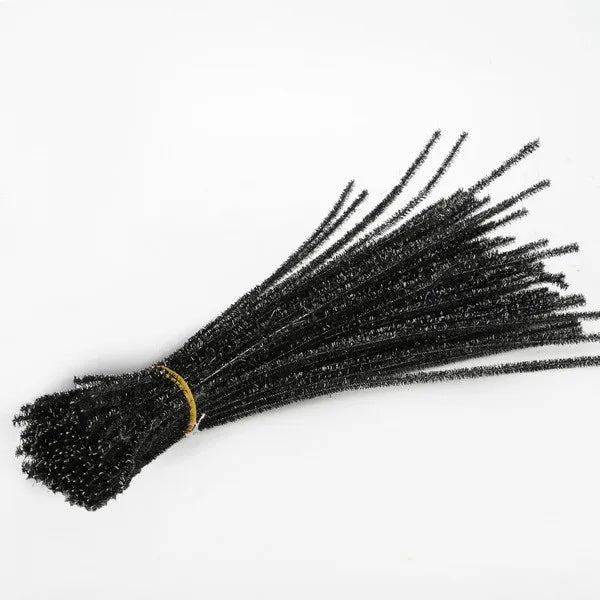 Bunch of black pipe cleaners on a white background
