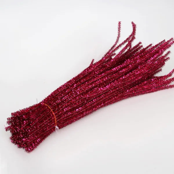 Bunch of red pipe cleaners on a white background